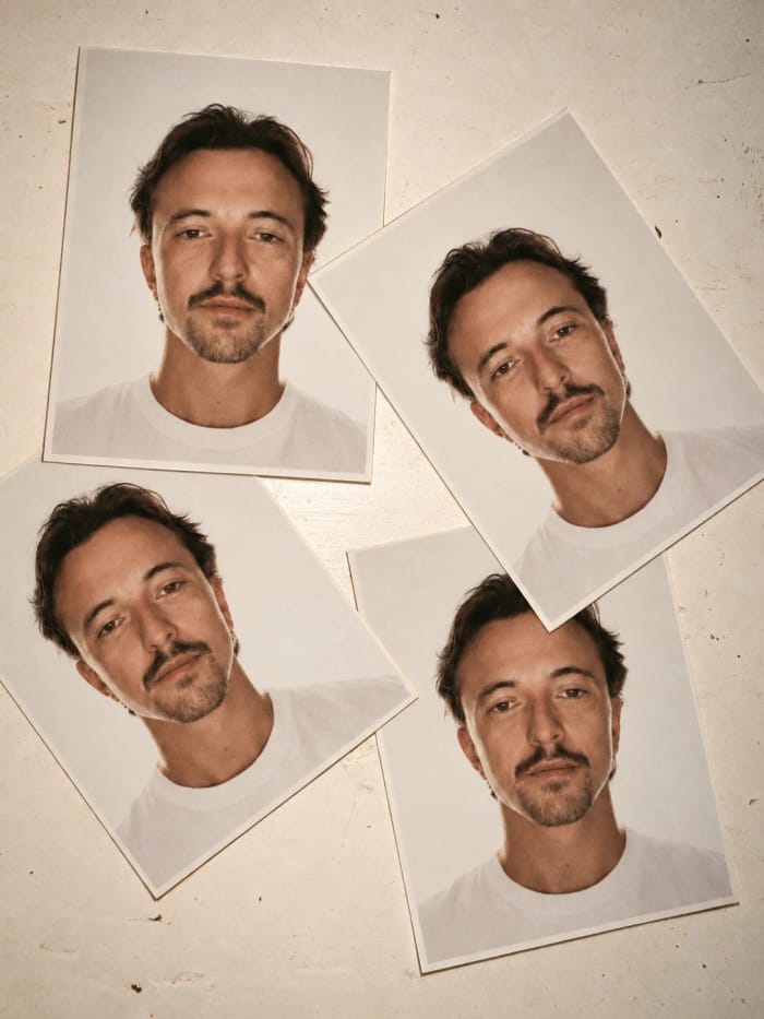 Four photo-booth portraits of Jack Lydon in a white T-shirt, laid out on a cream surface.